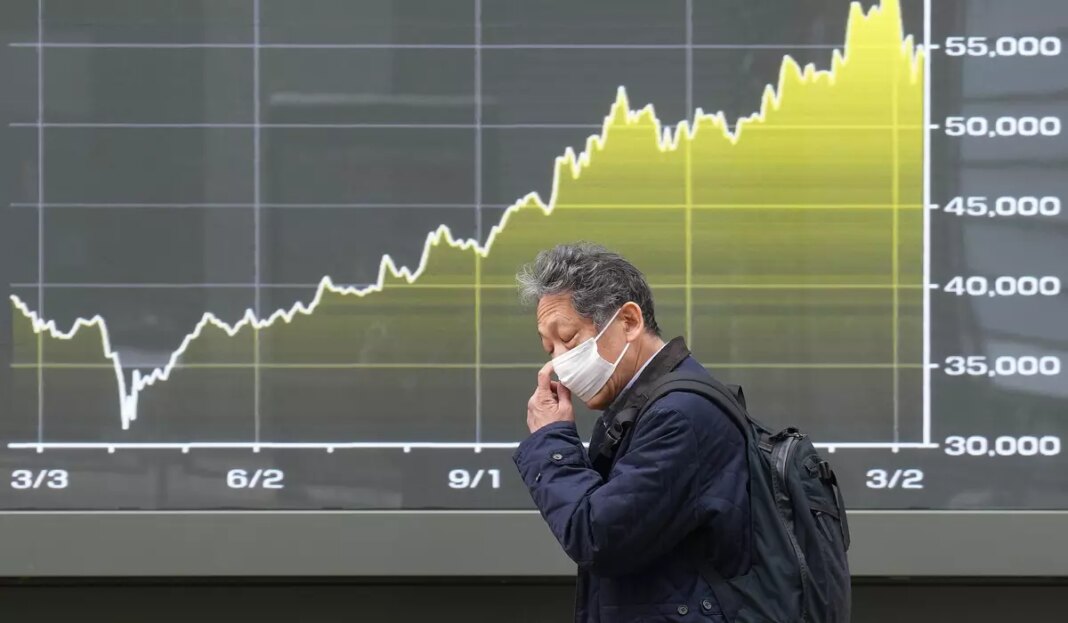 World shares decline, while oil pops above $100 a barrel over Iran war worries