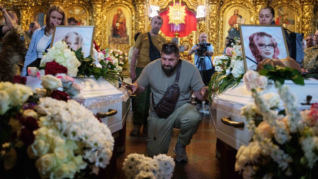 Kyiv holds a funeral for 2 young sisters killed by a Russian missile strike
