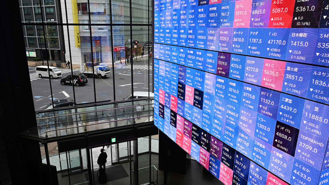 Japanese stocks rose as bond yields and the yen fell after rate hike
