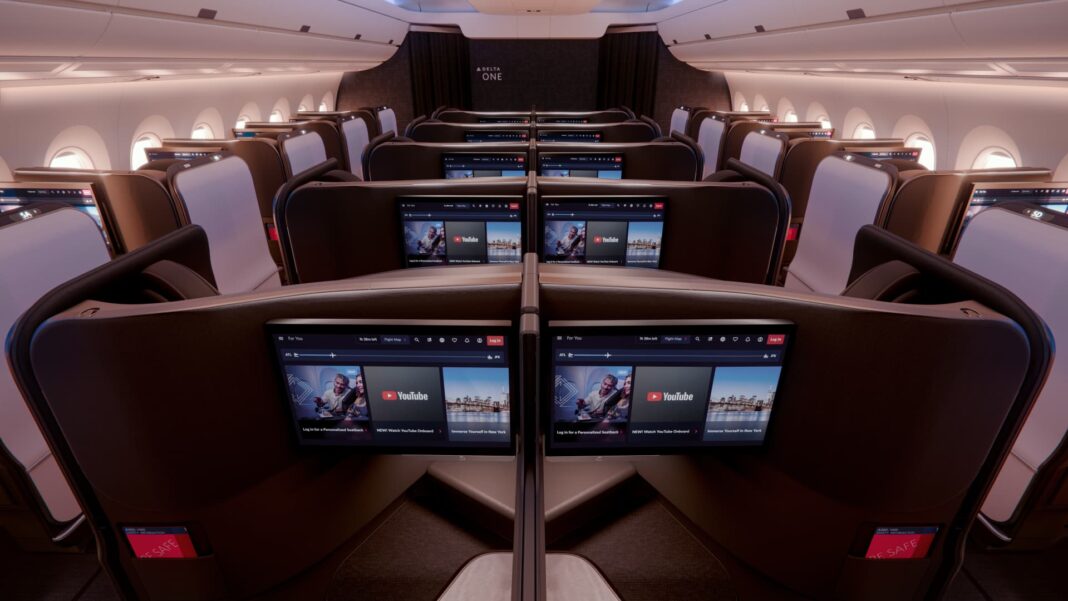 108290073 1775854656116 A350 1000 Delta One Suite D1 cabin facing forward highlighting screens.jpg